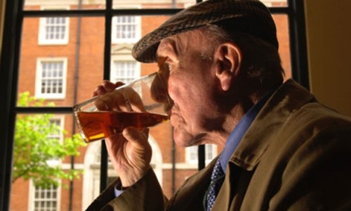Old-man-drinking-pint-of-007
